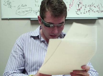 Teaching Assistant Adam Spencer usesGoogle Glass to record feedback for students as he goes over their work.